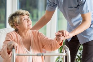 Old,Woman,Gets,Help,With,Walking,From,A,Nurse